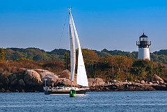 Sailboat by Ten Pound Island Light in Gloucester, Massachusetts